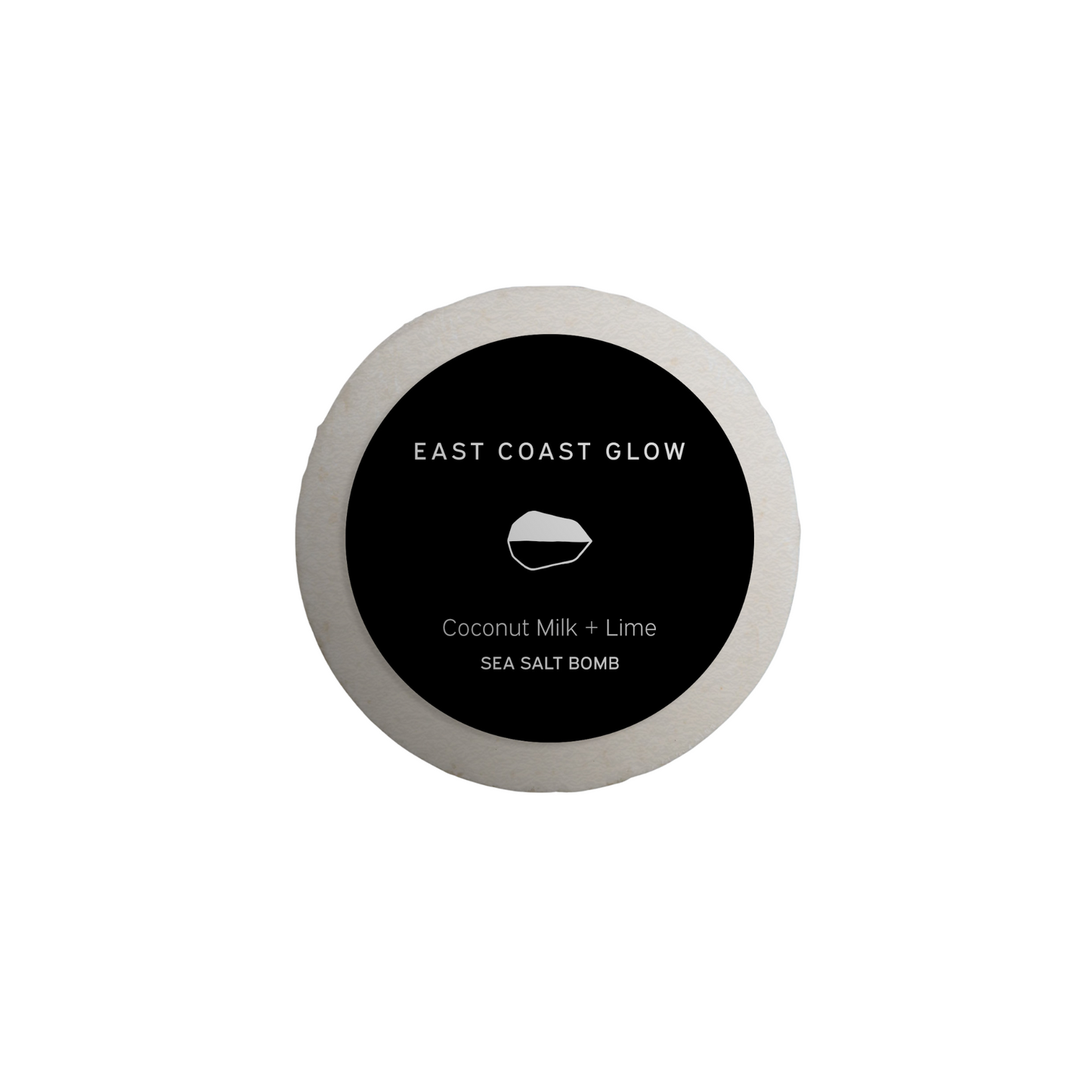 East Coast Glow Coconut Milk + Lime Salt of the Earth™ Sea Salt Bomb with organic coconut milk, lime essential oil, and wildcrafted botanicals for a nourishing and relaxing bath.