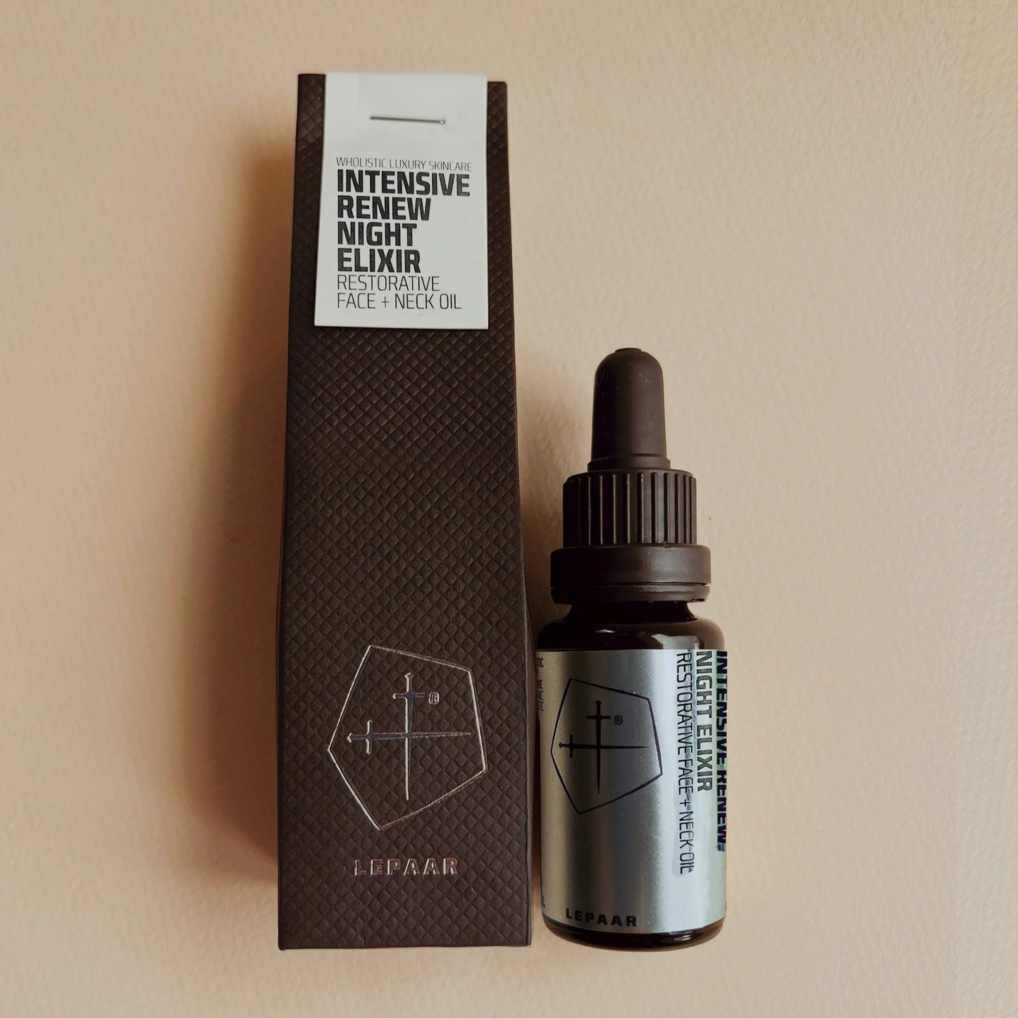Lepaar Intensive Renew Night Elixir bottle and packaging on a beige background