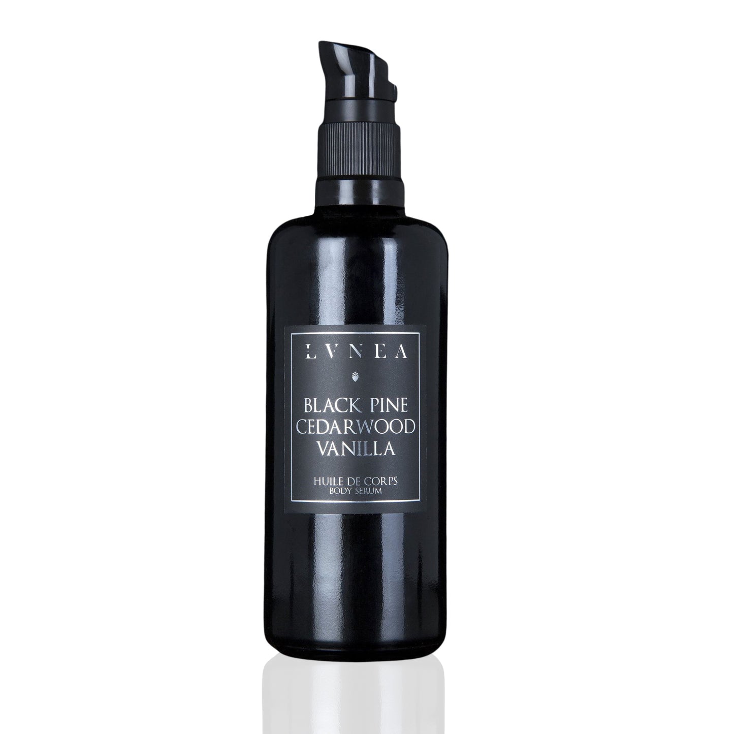 LVNEA Botanical Body Serum in an amethyst glass bottle with pump dispenser, showcasing the luxurious blend of black pine, cedarwood, and vanilla.