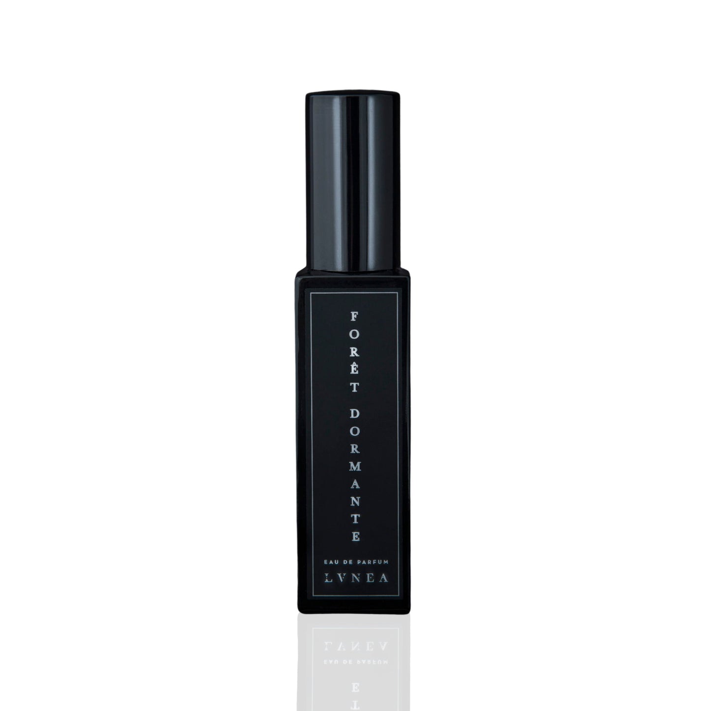 LVNEA Forêt Dormante Eau De Parfum in a 30ml black glass bottle with notes of piñon pine, lavender, rose de mai, and frankincense, evoking the calm, dewy slumber of a pre-dawn forest. 30ml