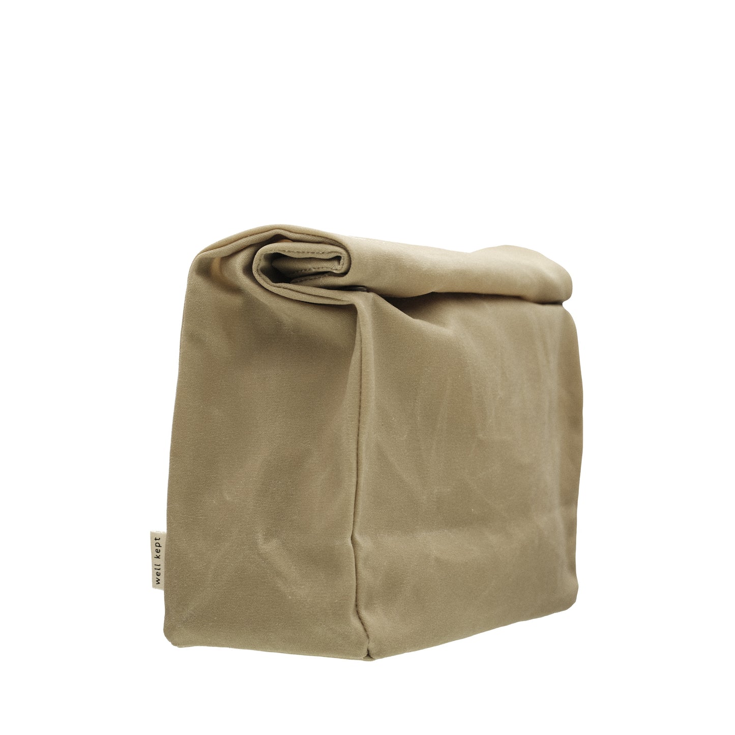 Well Kept Large Dopp Kit in Stone, a durable, water-resistant waxed cotton travel bag with a roll-down design and snap closure.