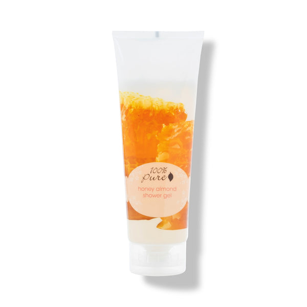 Bottle of 100% PURE Honey Almond Shower Gel, hydrating and sulfate-free body wash with red algae, green tea, and coconut oil, lightly scented with sweet honey-glazed almonds, 8 oz / 236 ml.