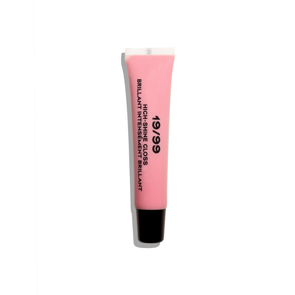 A pink squeeze tube of 19/99 High Shine Gloss with a black cap, shown vertically on a white background with a soft shadow.