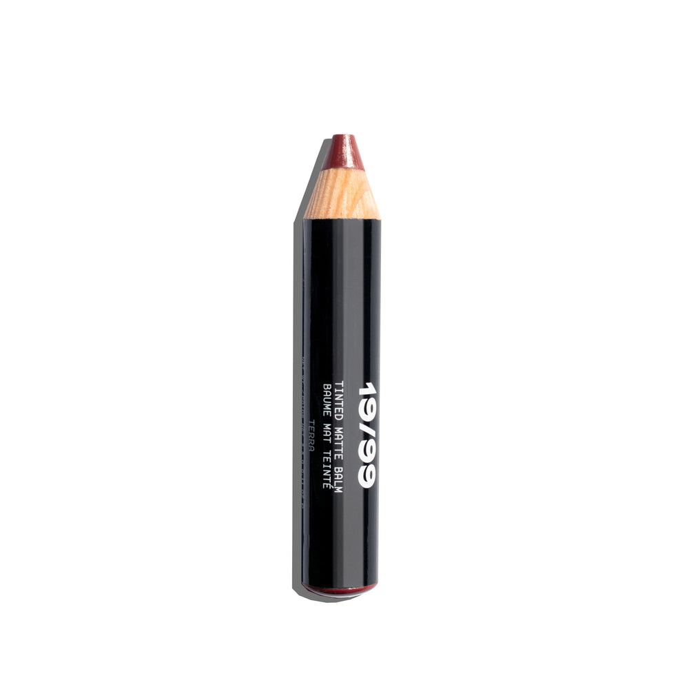  19/99 BEAUTY Tinted Matte Balm – versatile plum shade for lips, cheeks, and eyes.