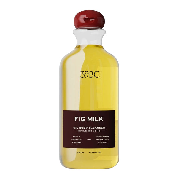 A 280ml bottle of 39BC Fig Milk Oil Body Cleanser, featuring a clear bottle filled with yellow oil, a dark brown label, and a glossy red cap, set against a plain white background.