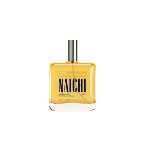 NATCHI Hair & Body Oil in a sleek bottle with spray top, designed to hydrate and nourish skin and hair naturally.