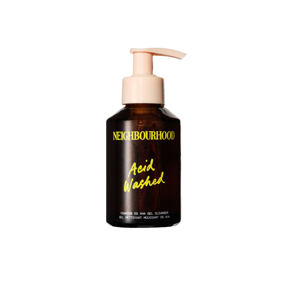 NEIGHBOURHOOD BOTANICALS 'Acid Washed' Foaming 5% AHA Gel Cleanser in an amber glass bottle with pump, featuring a lactic acid formula for a fresh, smooth-looking complexion.