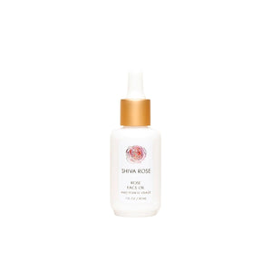 Hand-blended SHIVA ROSE Rose Face Oil with organic oils for skin nourishment, featuring key ingredients like jojoba and rosehip seed oil.