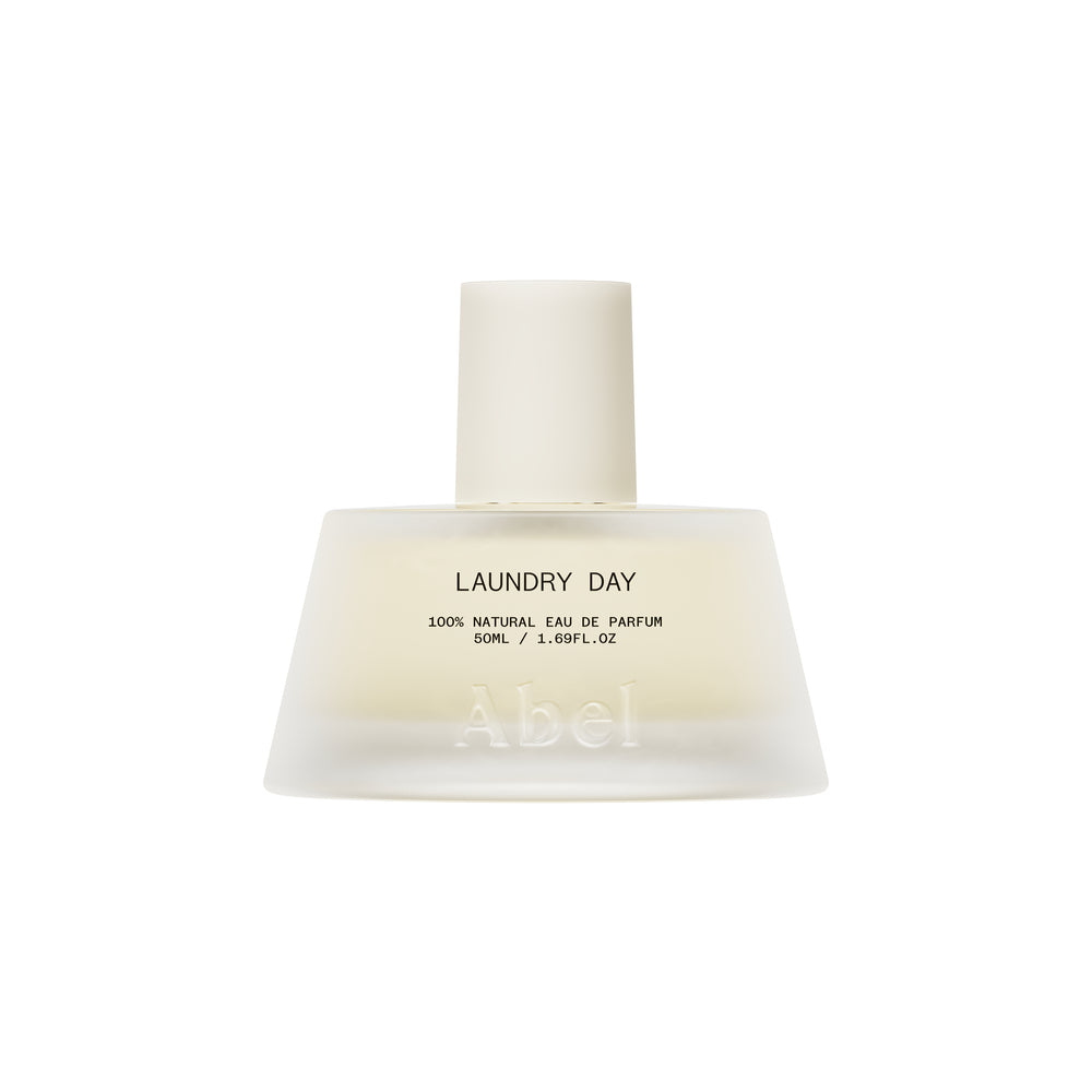 A frosted glass bottle of Abel Laundry Day 100% Natural Eau de Parfum, 50ml, featuring a matte off-white cap and black text on a clean white background.