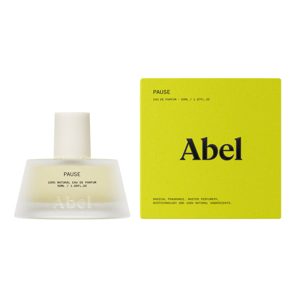 Abel Pause Eau de Parfum bottle next to its lime green packaging box on a white background.