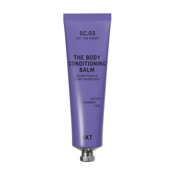 A lavender purple squeeze tube of AKT London The Body Conditioning Balm (SC.03 the Onsen) with a silver metal cap, centered on a light off-white background with a soft shadow.