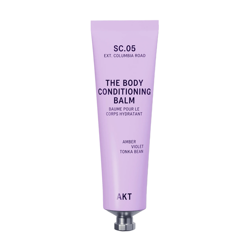 A lavender purple ze tube of AKT London The Body Conditioning Balm, scent SC.05 Columbia Road, on a clean off-white background.