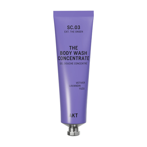 A lavender purple squeeze tube of AKT London The Body Wash Concentrate (SC.03) with a silver metal cap, centered on a clean off-white background.