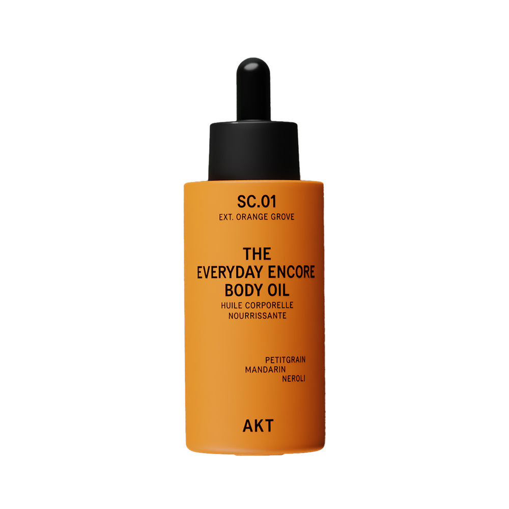 A bottle of AKT London The Everyday Encore Body Oil in the scent SC.01 Orange Grove.