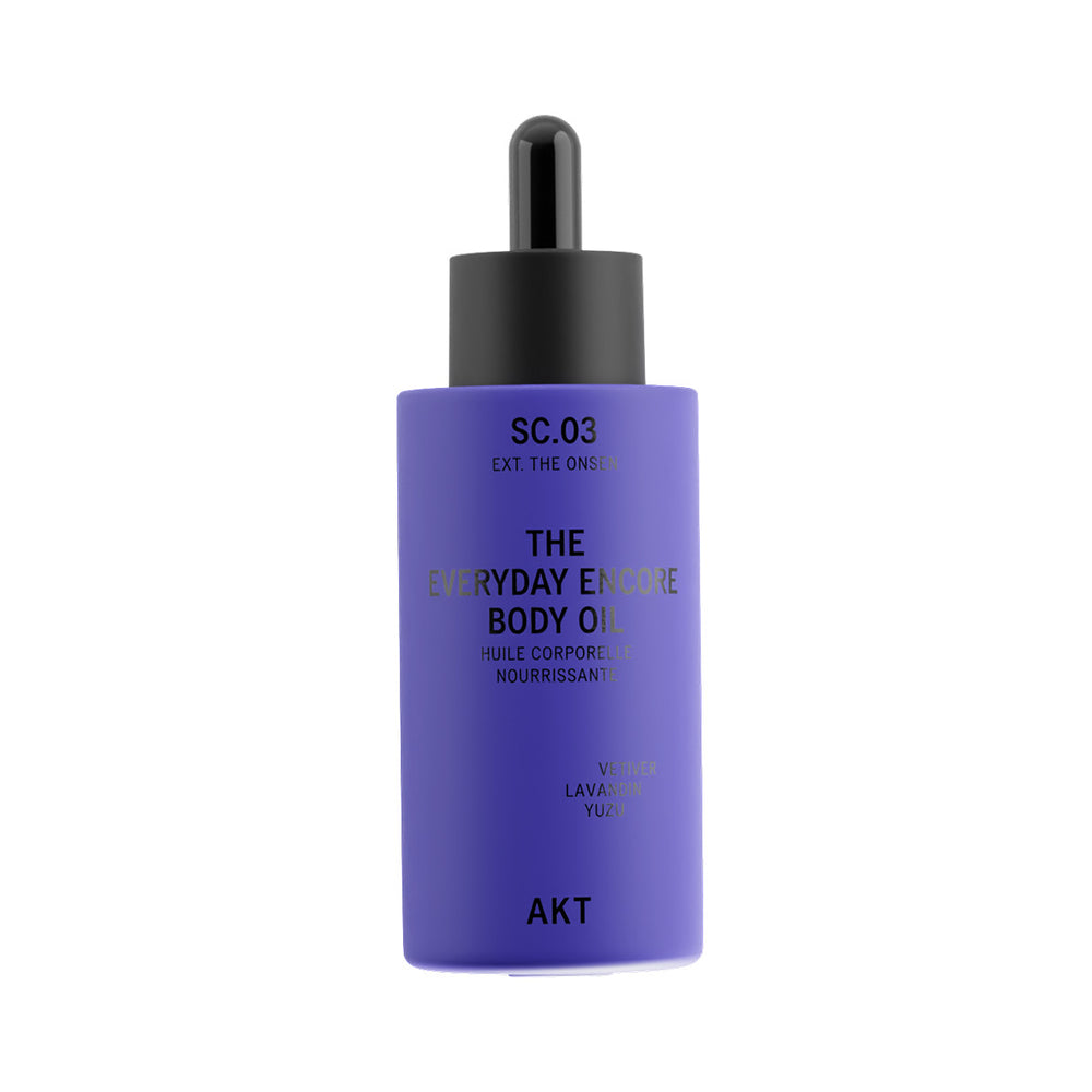 A bottle of AKT SC.03 The Everyday Encore Body Oil in a lavender purple color with a black dropper cap, shown on a plain white background.
