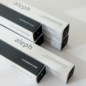 A few boxes of aleph mascara on a white background