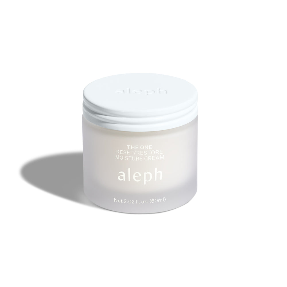 Aleph The One Reset and Restore Moisture Cream in a sleek glass jar, a versatile moisturizer for hydrated, radiant skin.