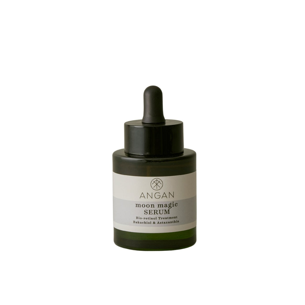 Angan Moon Magic Serum in a dark green glass dropper bottle with a black cap and a white label, centered on a plain white background.