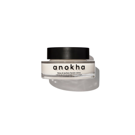 ANOKHA Lotus & Lychee Facial Crème in a glass jar, showcasing its lightweight formula enriched with lotus flower and lychee extracts for a radiant complexion.