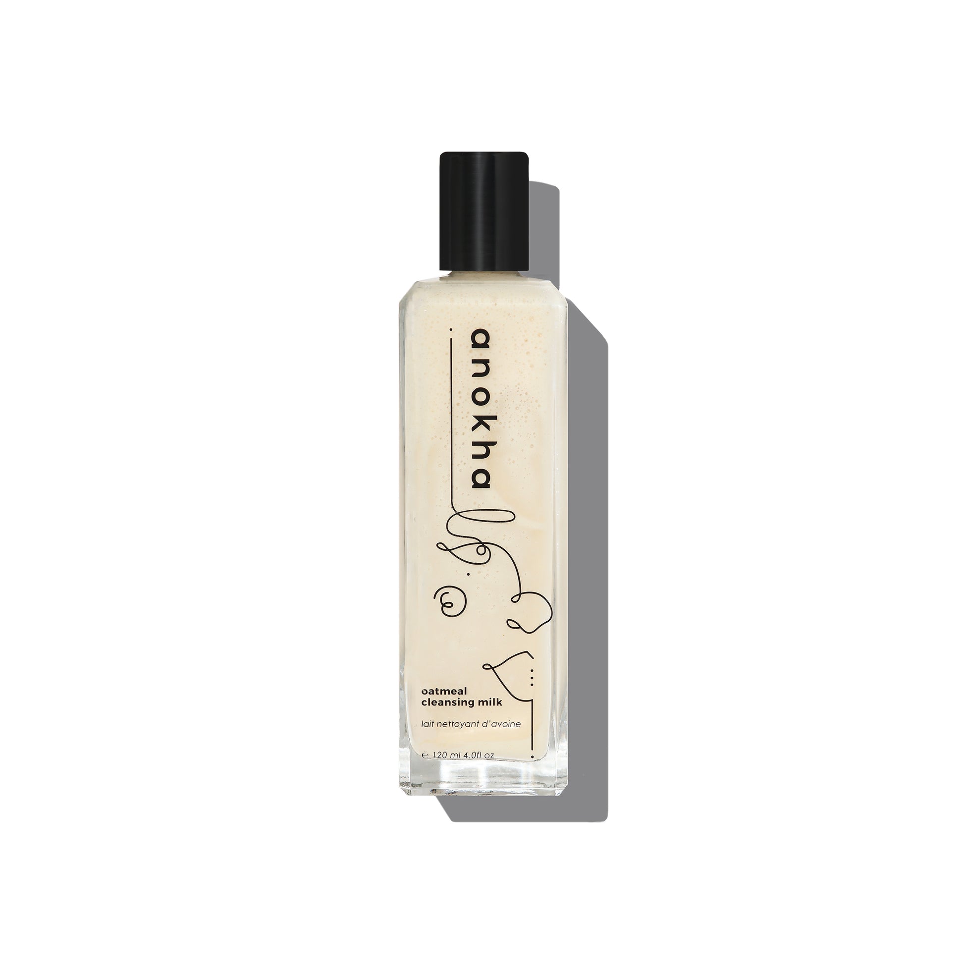 ANOKHA Oatmeal Cleansing Milk in a pump bottle, showcasing a gentle facial cleanser designed to refresh and soften the skin with a soothing oatmeal scent.