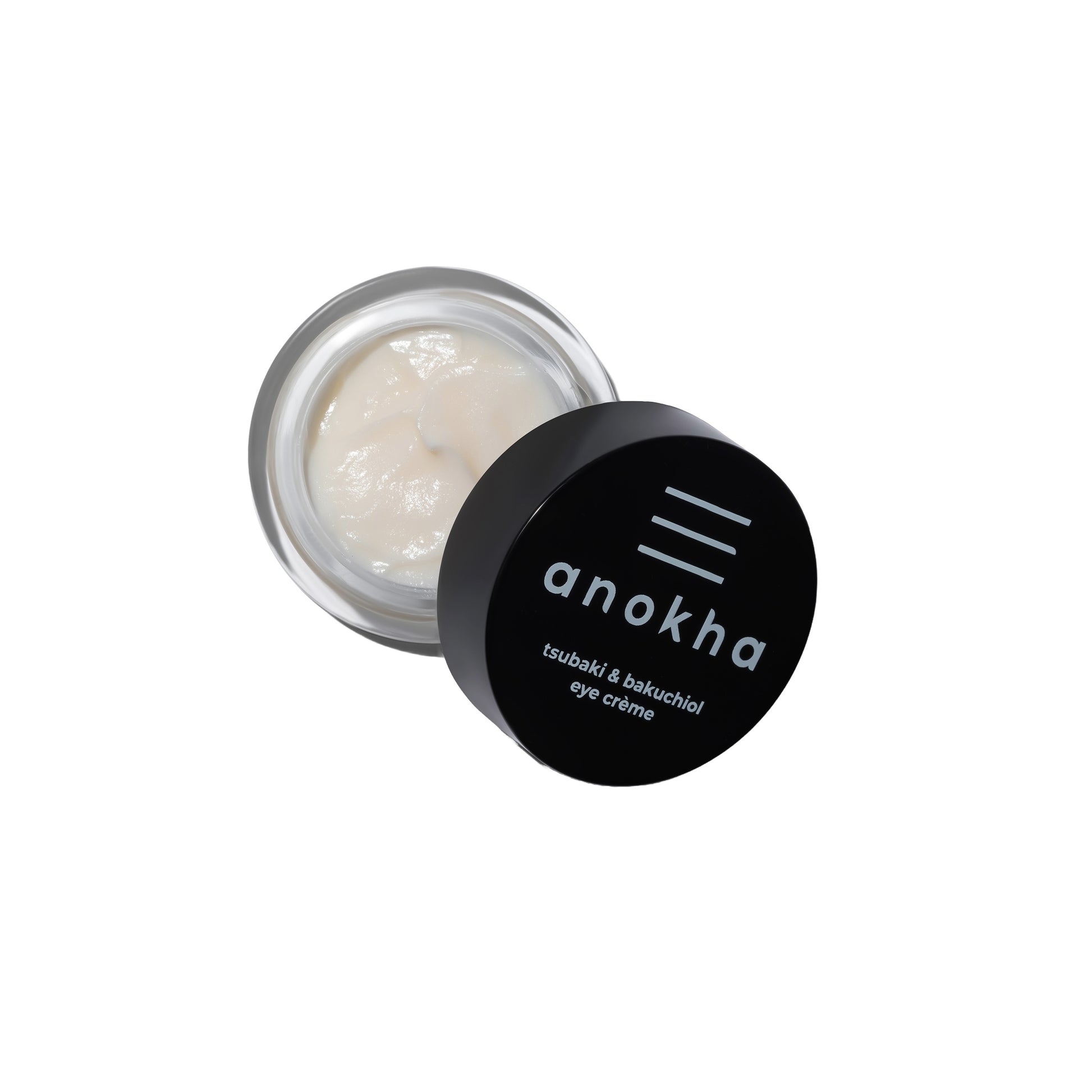 ANOKHA Tsubaki & Bakuchiol Eye Crème in a sleek jar, showcasing its brightening formula with natural ingredients designed to nourish and refresh the eye area.