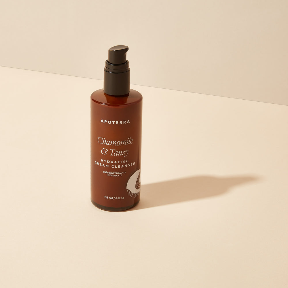 Apoterra Chamomile & Tansy Hydrating Cream Cleanser bottle with gentle, soothing formula featuring chamomile, blue tansy, and aloe for hydrated, refreshed skin.