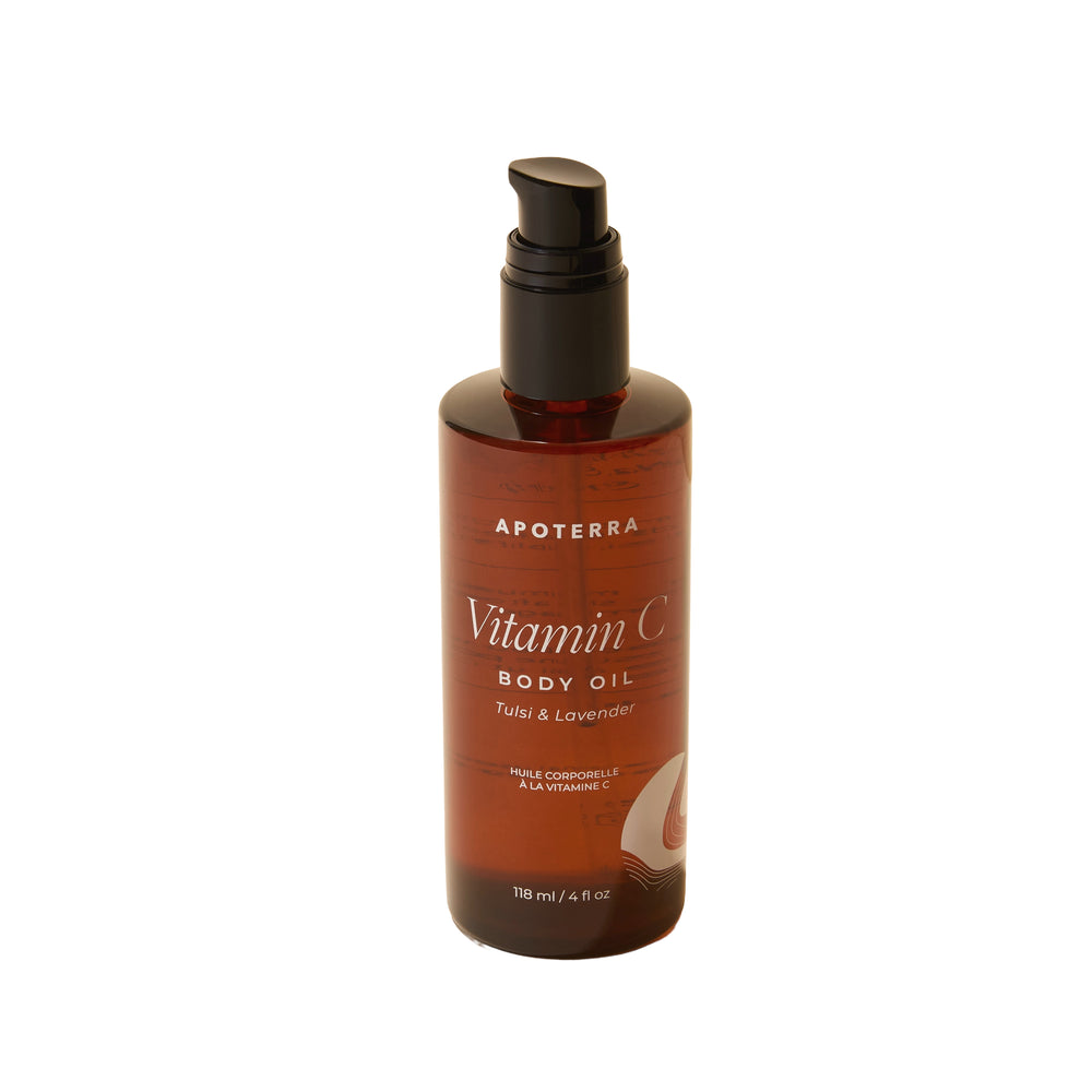 Apoterra Vitamin C Body Oil Tulsi and Lavender bottle with natural ingredients including tulsi leaves, lavender flowers, and orange peel.