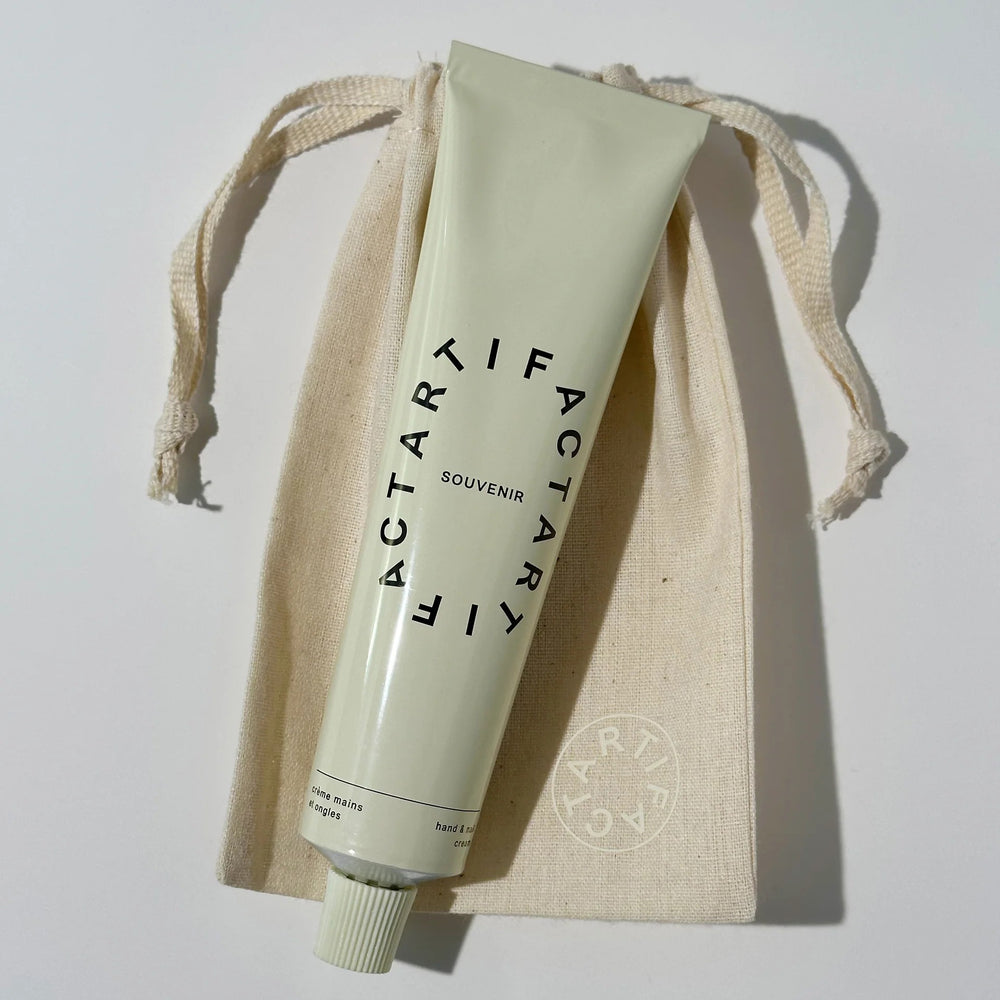 ARTIFACT Souvenir Hand & Nail Cream in recyclable aluminum tube with citrus and cedar scent
