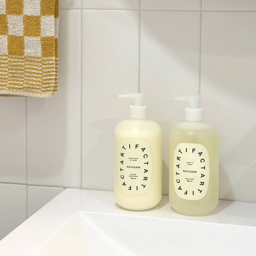 Artifact Big Wave Hand & Body Lotion with Sea Kelp, Green Tea, Carrot Tissue Oil, and a fresh Rosemary, Lime, and Rosewood scent for nourishing, firm skin.