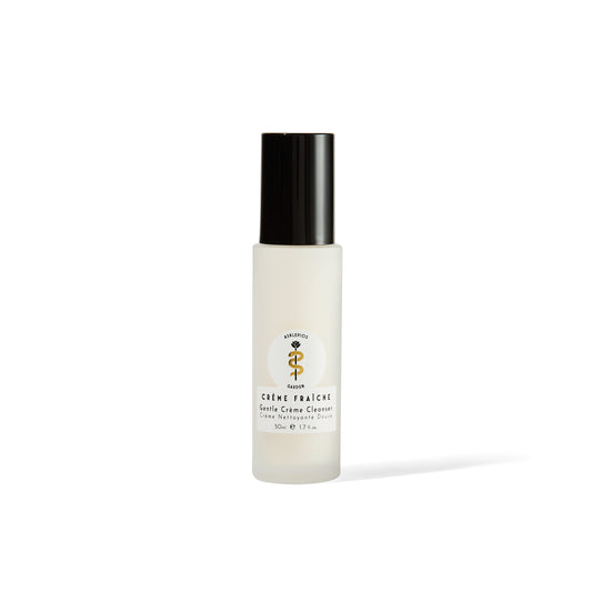 Asklepios Garden Crème Fraîche Gentle Crème Cleanser in an elegant Italian glass vessel, showcasing its natural ingredients and soothing formula.