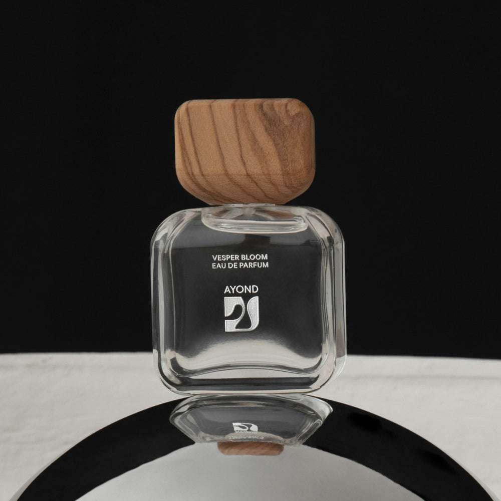 Vesper Bloom perfume bottle by Ayond with wooden cap on a white background