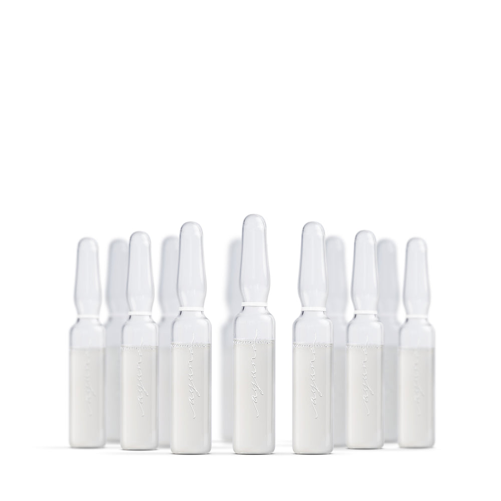 Multiple skincare serum ampoules from Ayuna on a white background