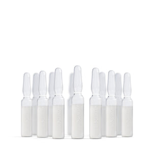 Multiple skincare serum ampoules from Ayuna on a white background