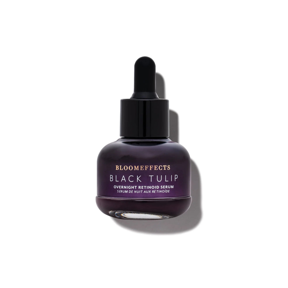 BLOOMEFFECTS Black Tulip Overnight Retinoid Serum in dropper bottle, nourishing overnight facial serum for smooth and hydrated skin, on white background.