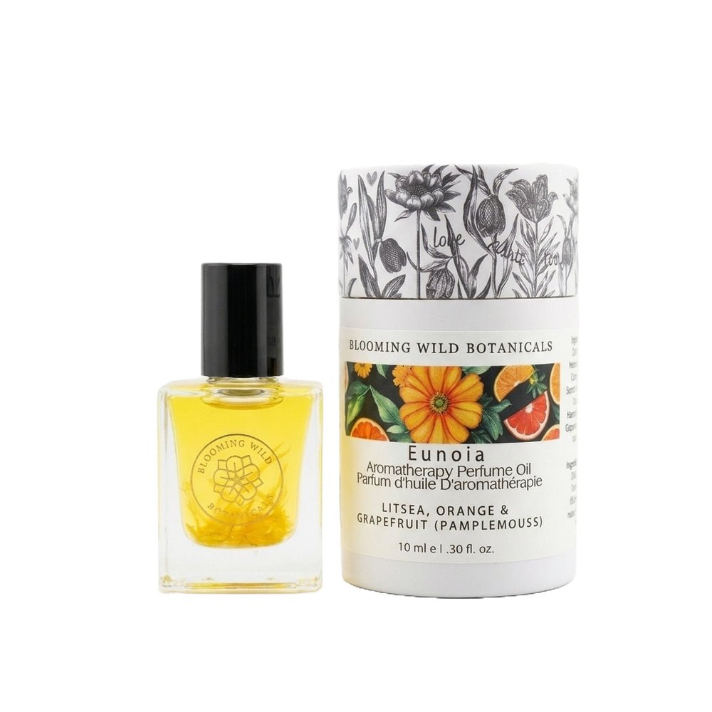 Perfume oil bottle and packaging of Blooming Wild Botanicals on a white background