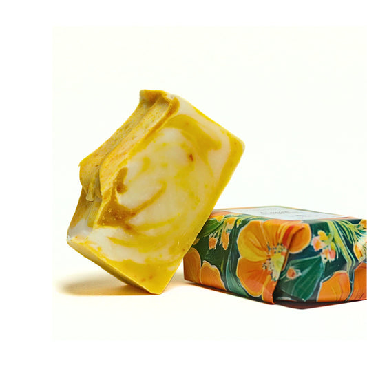 Blooming Wild Eunoia Soap bar featuring bright grapefruit and orange oils with nourishing shea butter, designed for a refreshing and softening citrus cleanse.