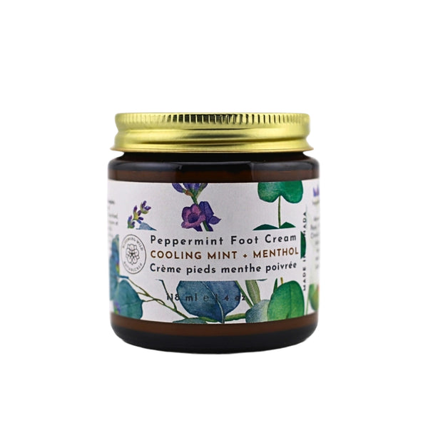Jar of peppermint foot cream with a gold lid on a white background