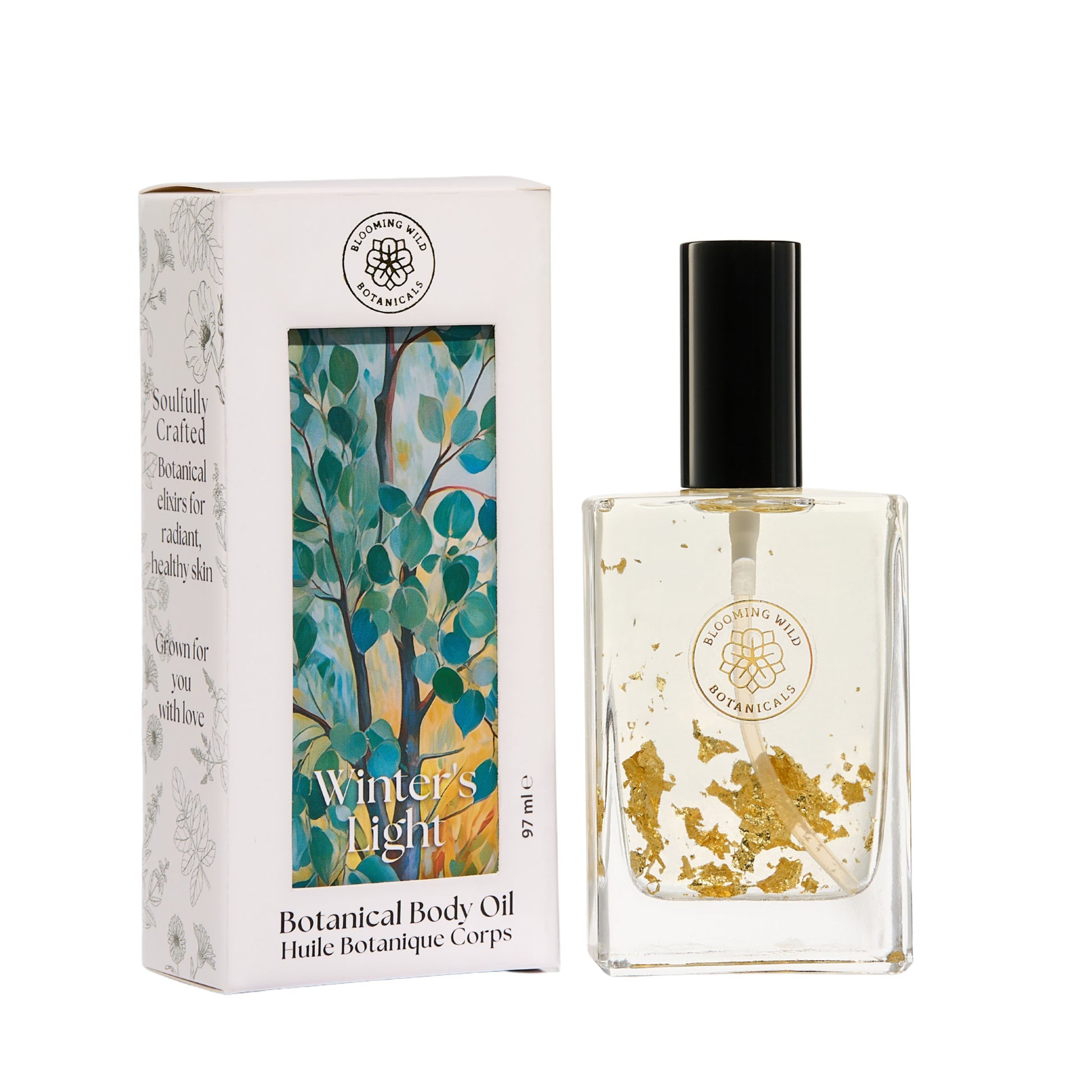 Blooming Wild Winter’s Light Botanical Body Oil with slow-infused dandelion and 24k gold flakes in a glass bottle, designed to soften and refresh skin.