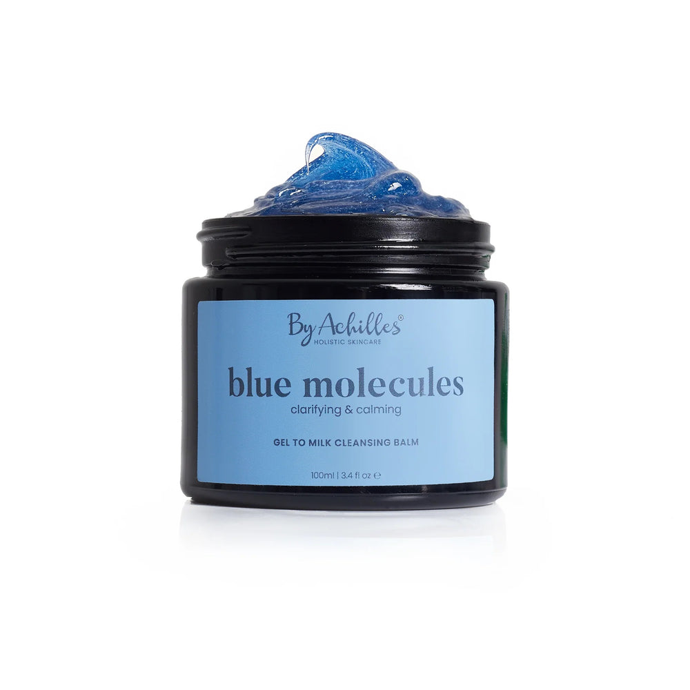 By Achilles Blue Molecules Cleansing Balm in a jar with natural ingredients like Blue Tansy, Yarrow, and Blue Chamomile. Gentle, hydrating oil-to-milk cleanser for soft, balanced skin.