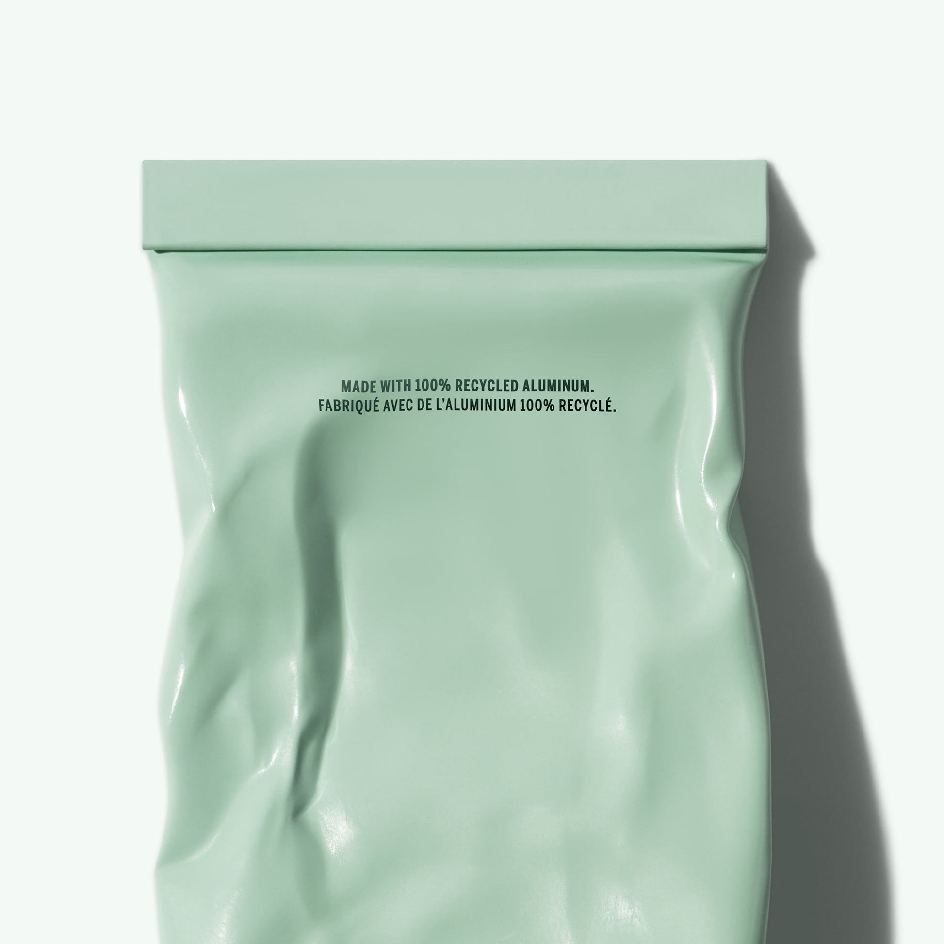 Green packaging with recycled aluminum text on a white background. CORPUS Aromatic Hand Cream Amalgam 7