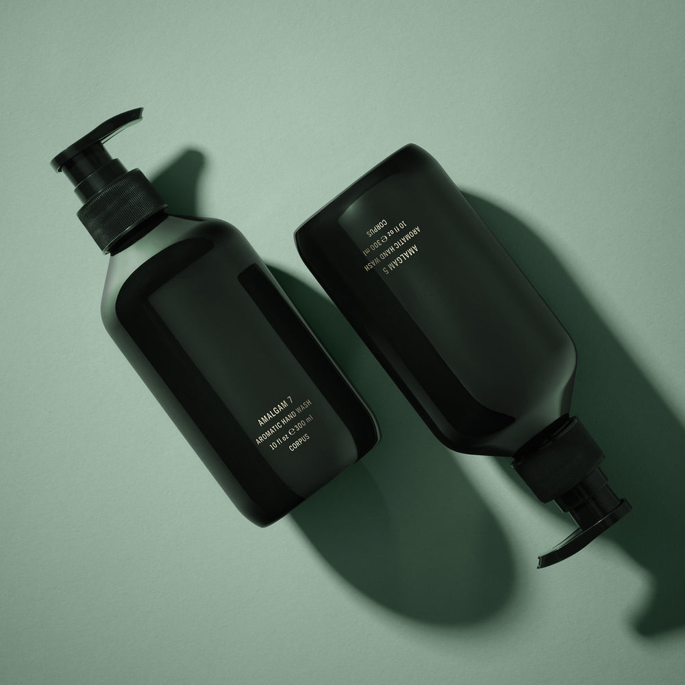 CORPUS Aromatic Hand Wash Amalgam 7 in a recycled plastic bottle with FSC-certified packaging, scented with pink peppercorn, cedar, patchouli, fennel, and bergamot.
