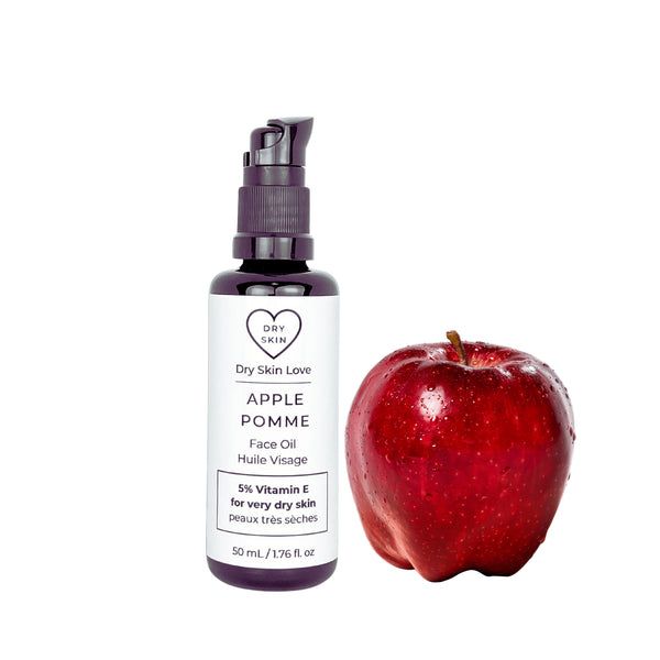 Dry Skin Love Apple Elixir 5% Vitamin E Face Oil in black glass 50ml bottle with white label and black pump for dry skin with blend of vitamin E forms, apple seed oil, coconut oil, and chamomile extract.