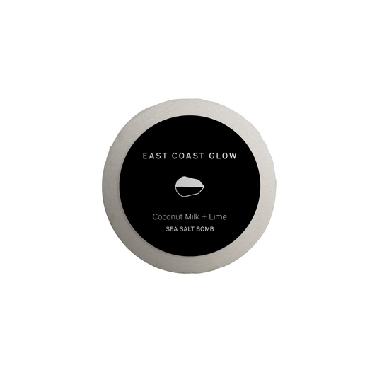 East Coast Glow Coconut Milk + Lime Salt of the Earth™ Sea Salt Bomb with organic coconut milk, lime essential oil, and wildcrafted botanicals for a nourishing and relaxing bath.