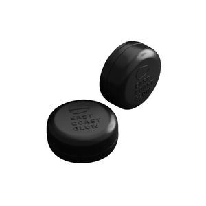 Aluminum travel tin with draining base for storing East Coast Glow solid shampoo or conditioner bars, ideal for travel and daily use. Black