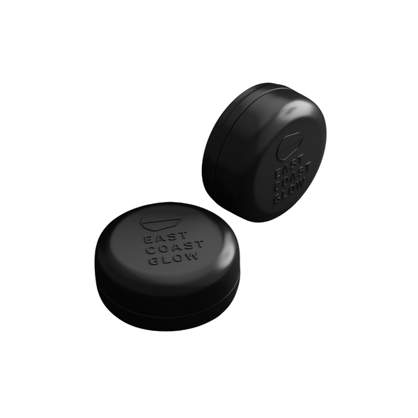 Aluminum travel tin with draining base for storing East Coast Glow solid shampoo or conditioner bars, ideal for travel and daily use. Black