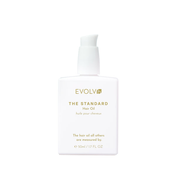 EVOLVh The Standard Hair Oil in white bottle with white pump.