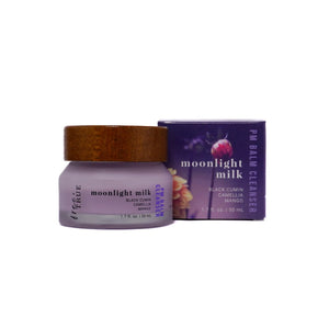 FREE + TRUE Moonlight Milk PM Balm Cleanser in clear glass jar with bamboo wood lid and next is the product's box, on white background