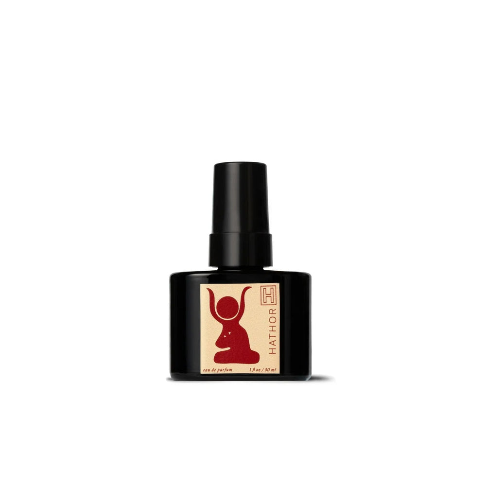H IS FOR LOVE HATHOR Eau de Parfum bottle on white background, highlighting a natural perfume made with steam-distilled essential oils and organic cane alcohol.