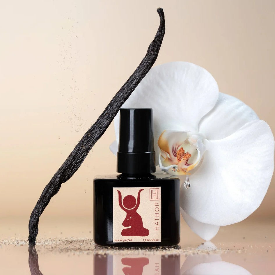 H IS FOR LOVE HATHOR Eau de Parfum bottle on white background, highlighting a natural perfume made with steam-distilled essential oils and organic cane alcohol.