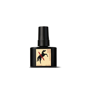 Black perfume bottle with a horse illustration on a beige label against a white background